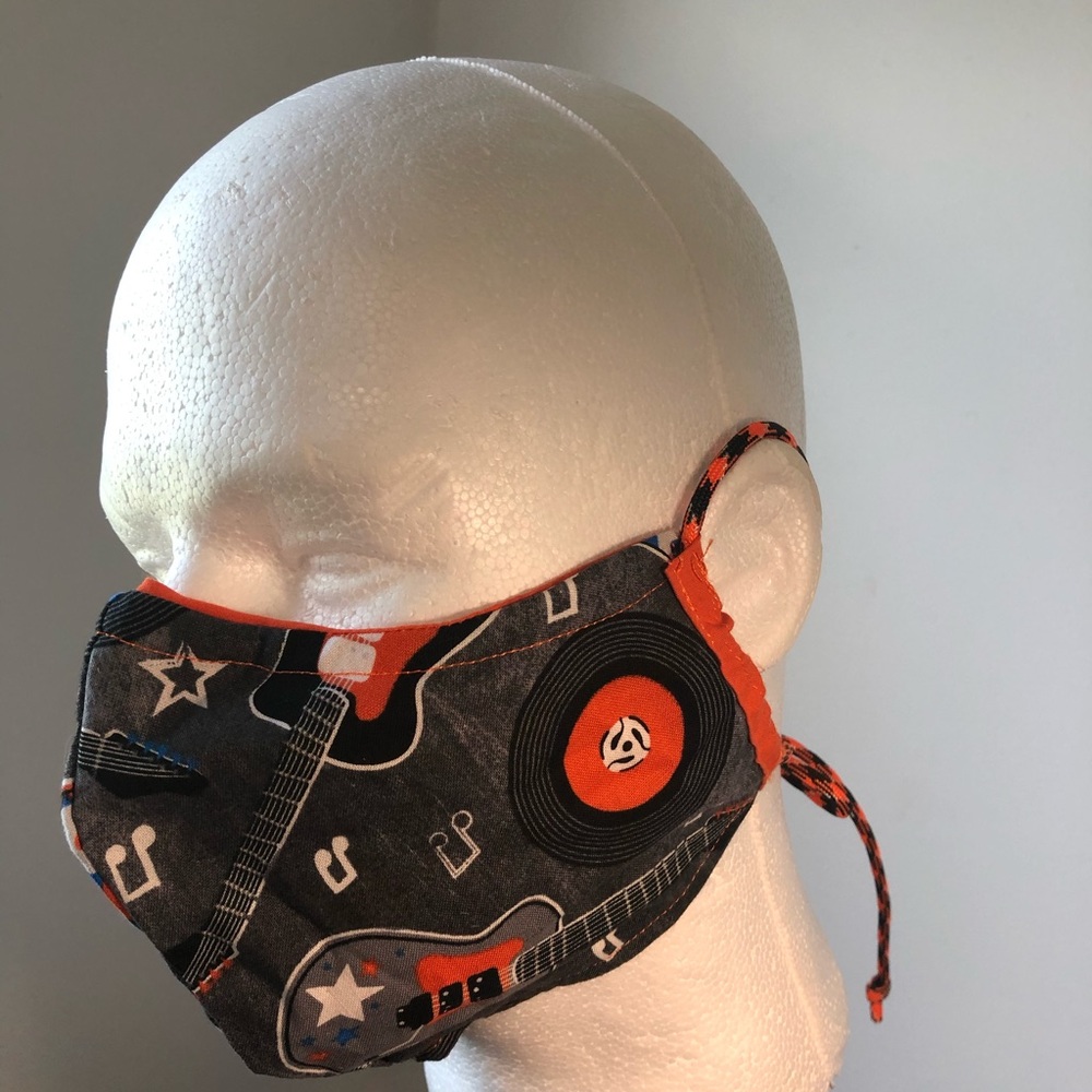 Orange/black reversible filter washable mask.